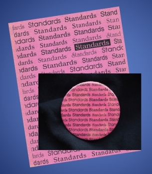 lapel button & standards booklet covered by many "standards" words
